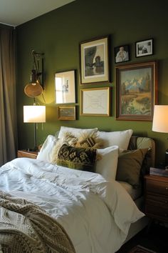 a bedroom with green walls and pictures on the wall above the bed, along with two lamps