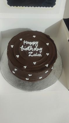 a chocolate birthday cake in a white box