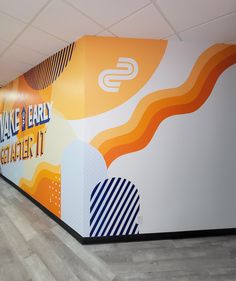 the wall is painted with an orange and blue design