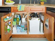 an open cabinet in the middle of a kitchen