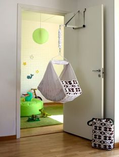 a child's swing hanging from the ceiling