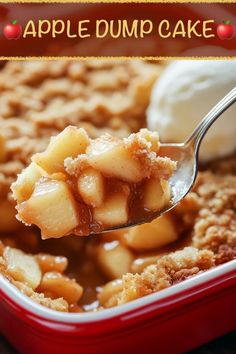 a spoonful of apple dump cake on top of a red dish with ice cream