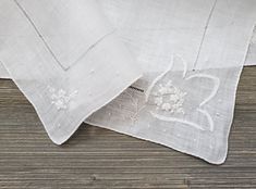 10% Off 2 or More Code SAVE10 Vintage Wedding Handkerchief ~ This all white hankie features embroidered flowers, appliqué and drawn-thread details. The needlework is exceptional.  It is made of soft cotton and has a rolled hem. A perfect 'something old' something beautiful for the bride!  Measures 12 x 12 inches Thanks for visiting → RoseAnaDana.Etsy.com . More Code, Drawn Thread, Wedding Handkerchief, Something Old, Rolled Hem, Something Beautiful, All White, Embroidered Flowers, Vintage Wedding