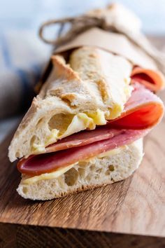 a sandwich with ham, cheese and tomato on it