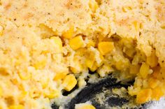 a close up view of corn casserole in a pan with it's crust removed