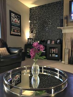 a living room with a couch, chair and coffee table