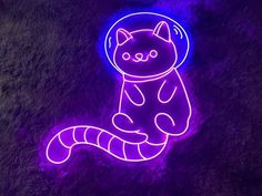 a neon cat is sitting on the ground