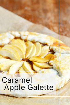 a caramel apple galette on a piece of parchment paper with text overlay that reads caramel apple galette