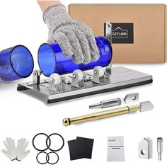 a blue glass bottle with gloves on it and other items in front of the package