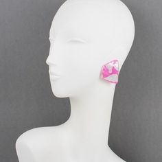 These stunning Anne and Frank Vigneri Lucite clip-on earrings feature a dimensional curved geometric design. The earrings are built with multilayer Lucite, a white background topped with bubblegum pink Lucite with embedded silver foil inclusions. There is no visible signature, although the very specific French clip-back is an unmistakable brand signature. Anne & Frank Vigneri made gorgeous, over-the-top lucite jewelry from 1982 to 1994. Their designs were bold and inventive and so original they Modern Pink Jewelry For Party, Modern Pink Party Jewelry, Handmade Pink Clip-on Earrings For Party, Modern White Clip-on Earrings, Pink Geometric Earrings, Lucite Jewelry, French Clip, Pink And Silver, Anne Frank