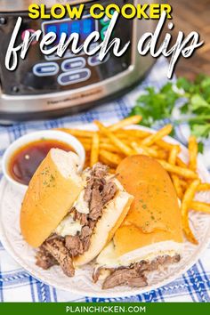 slow cooker french dip sandwich on a plate with fries