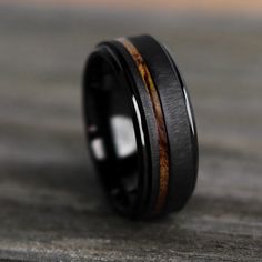 black ceramic ring with wood inlays on top