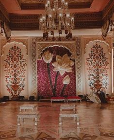 an elaborately decorated room with chandelier and flowers