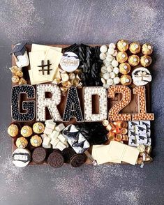 the word grad is spelled out with chocolates and candies