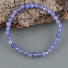 Gemstone : TanzaniteTreatment : NaturalStone size : 5 MM Finish/Shape : Smooth RoundQuality : AAASilver Weight In Carat : 0.60 CtBracelet Carat Weight :40 CaratStretchable braceletLength : We have multiple sizes. Please select the bracelet size at checkoutWe have used 925 sterling silver balls in the bracelet.*Free Mystery Gift With Every Purchase.Happy Shopping Amethyst 8mm Beads Jewelry Gift, Round Crystal Bead Bracelet As Gift, Crystal Bracelet With Round Beads As Gift, Spiritual Round Beaded Bracelets For Anniversary, Spiritual Beaded Birthstone Bracelets, Sapphire Jewelry With 8mm Beads, Sapphire Round Beads Bracelet As Gift, Sapphire Round Beads Bracelet Gift, Sapphire Round Beads Bracelet For Gift