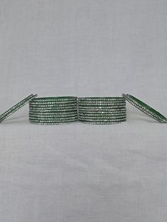 Bangles Name - Penali abu dabe colour - green   Size - 2.2/2.4/2.6/2.8   Weight - 60 grams   Piece - 12   Stone colour - white  100% Glass Bangles & Handmade Product. You can wear it while going to a wedding by matching it with your clothes. You can also gift it to someone. You can also wear it in an engagement. It looks very beautiful in your hands. about shipping  Ships within 1 to 3 business days after payment is received  We ship orders every day except Sundays and holidays  When your order Green Round Bracelets For Party, Adjustable Green Bangle For Party, Adjustable Green Bangle, Adjustable Green Round Bangle, 12 Stones, Glass Bangles, Bangles For Women, Stone Colour, Handmade Bangles