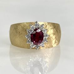 ruby ring, ruby vintage ring, ruby vintage, 14k gold ring, 14k ring women, 14k ruby ring, vintage ruby ring, ruby diamond ring, ruby vintage A Charming vintage ruby ring featuring an oval cut center stone weighing 0.67 carats complemented by sparkling white diamonds weighing 0.24 carats set in 14k brushed yellow gold. *Ring size: US 6 1/4 *Ring weight: 6.89 Grams *Center stone dimensions: 5.3X4.3mm Fine Jewelry Red Diamond Ring Stamped 14k, Oval Ruby Cluster Ring Stamped 14k, 14k Gold Ruby Ring With Rose Cut Diamonds, Fine Jewelry Ruby Cluster Ring Stamped 14k, Classic Ruby Diamond Ring Stamped 14k, Oval Ruby Ring Stamped 14k, Fine Jewelry Ruby Diamond Ring Stamped 14k, Fine Jewelry 14k Diamond Ruby Ring, Fine Jewelry Diamond Ruby Ring 14k