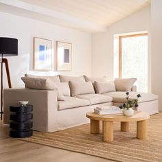 a living room filled with furniture and a coffee table