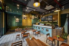 an empty restaurant with wooden tables and chairs