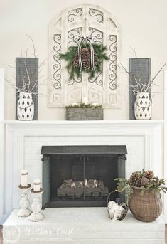 the fireplace is decorated with christmas decorations