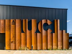 an orange building with the word ucc painted on it's front and side