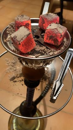 four pieces of red velvet cake on a glass plate