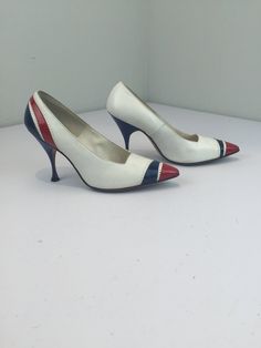 "Circa: 1950s A very classic look even a bit patriotic too. Navy, white and red patent leather stiletto classic heels. Tall and slender with a beautiful cut work of pattern on the backs of the heels and racing striped to draw the eyes up to the curve of the foot to ankle and thus the leg. *Vintage shoes are like the women who wear them, one of a kind & very unique* Label: Chandler's - French Room Fabric: patent leather, leather inner and outer Condition:  Excellent Vintage Condition. * Bottom so Retro Court Shoes With 4-inch Heel And Pointed Toe, Retro White 4-inch Heels, White Retro Fitted Heels, Retro White Pointed Toe Heels, White Retro Heels With Pointed Toe, Retro High Heel Heels For Vintage Fashion, Retro High Heels For Vintage Fashion, Retro Pointed Toe Court Shoes With 4-inch Heel, Retro Heels With Pointed Toe For Vintage Fashion