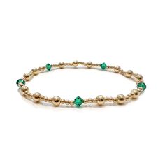 Hey May girlies! You just found a personal piece of jewelry to add to your daily stack! Wear your own emerald birthstone or pair with another to represent your kids, partner or family member! Stretch Bracelet, Roll onto Wrist 14k Gold-filled Beads Genuine Emerald Swarovski Crystal Bicone Beads Approximately 6.5 inches Handmade in the USA by Kinj Collective Shop the entire Beaded Birthstone Collection Green Birthstone Bracelets For Anniversary, Green Birthstone Bracelet For Anniversary, Faceted Round Bead Bracelets For May Birthstone, Adjustable Faceted Bead Bracelets For May Birthstone, Faceted Round Beads Bracelet For May Birthstone, Elegant Green Bracelet For Birthday, Faceted Beads Bracelets As May Birthstone Gift, Faceted Beads Bracelet For May Birthstone Gift, May Birthstone Bracelets With Faceted Beads As Gift