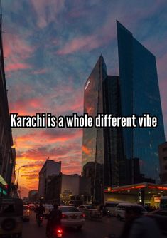 a city street filled with lots of traffic and tall buildings under a colorful sky that reads karaci is a whole different vibe