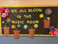 we all bloom in the music room bulletin board with flower potted plants on it