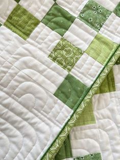 closeup of the green and white quilt