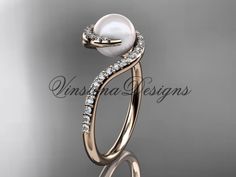 an elegant pearl and diamond engagement ring in 18k rose gold, with diamonds on the side