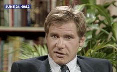 a man in a suit and tie is talking on the television show, which aired an episode