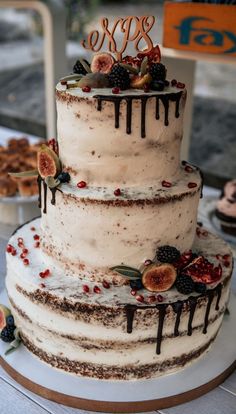 a three tiered cake sitting on top of a table