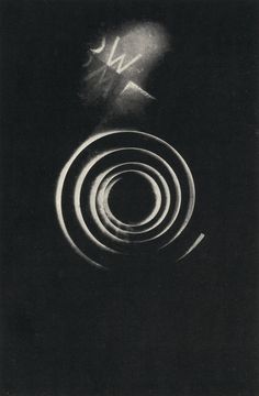 an abstract black and white photo with circles in the center, on a dark background