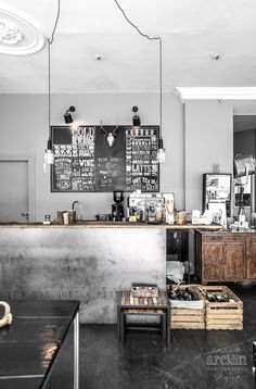 a black and white photo of a coffee shop