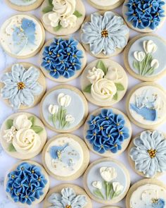 decorated cookies with blue and white flowers on them