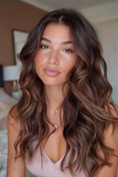 Woman with long, wavy brown hair, wearing a light pink top, sitting indoors. Fall Dark Hair With Highlights, New Hair For Brunettes, Brunette Hair Light Brown Highlights, Highlights For Chocolate Brown Hair, Candlelight Brunette, Brunette Color Hair, Dark Hair With Balayage Highlights, Balayage Touch Up, Chocolate Brown Hair With Babylights