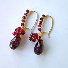 Discover the timeless elegance of these Natural Garnet Teardrop Earrings, the perfect unique gift for her. Handmade with genuine, real garnet gemstones in a deep red hue, these earrings exude luxury and sophistication.  🌟  Material: - Faceted red garnet teardrop gemstone 16mm - Micro faceted red garnet gemstone beads 4mm - 18K gold plated earrings hooks and earrings finding, oxidation and allergy prevention.  Lustre bright, enhance quality and extend the time limit of color retention. Lasting c Garnet Teardrop Earrings, Crystal Cluster Earrings, Gem Earrings, Earrings Unique, Unique Gifts For Her, Cluster Earrings, Red Crystals, Garnet Gemstone, Earring Findings