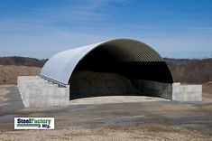 an empty covered parking garage in the middle of nowhere