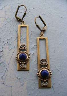 VINTAGE ELEMENTS Unique Jewellery, Handmade from Vintage Inspired , Original designs Striking Art Nouveau style, long, rectangular, Brass Filigree Earrings, inspired by Charles Rennie Mackintosh. Extremely light to wear. Ornate brass filigree settings feature Vintage Lapis Blue glass cabochons. These Earrings have brass leverback earwires and measure 5.5cm from the top of the earwires. Elegant Square Brass Jewelry, Vintage Rectangular Metal Earrings, Vintage Square Metal Jewelry, Vintage Brass Rectangular Jewelry, Vintage Square Earrings For Gift, Handmade Vintage Rectangular Earrings, Nickel Free Blue Rectangular Jewelry, Handmade Rectangular Metal Earrings, Handmade Rectangular Vintage Earrings