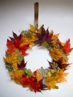 a wreath made out of autumn leaves