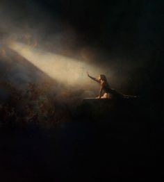 a woman sitting on top of a surfboard in front of a dark background with light coming from behind her