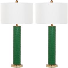 a pair of green lamps with white shades on each lamp and the same one in gold