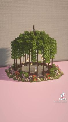 a small model of a park with trees and flowers