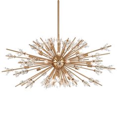 a gold chandelier with crystal drops hanging from the ceiling