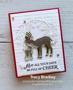 a card with an image of a deer and its baby in the center, saying may all your days be full of cheer