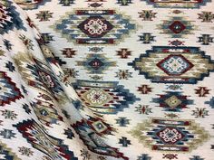 an area rug with many different colors and patterns