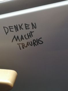 the writing is written on the side of a car door that says denken machh truvris