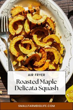 air fryer roasted maple delicata squash on a plate with fork and knife